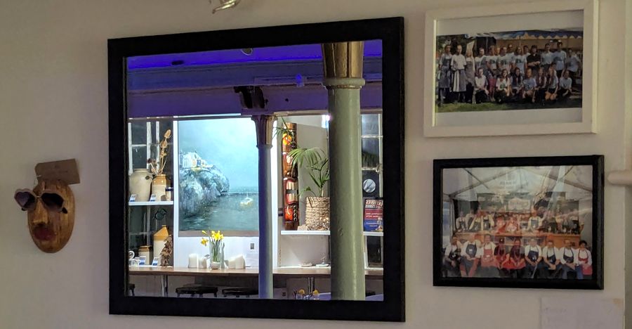 Chapel interior — mirror, local art and Port Isaac history